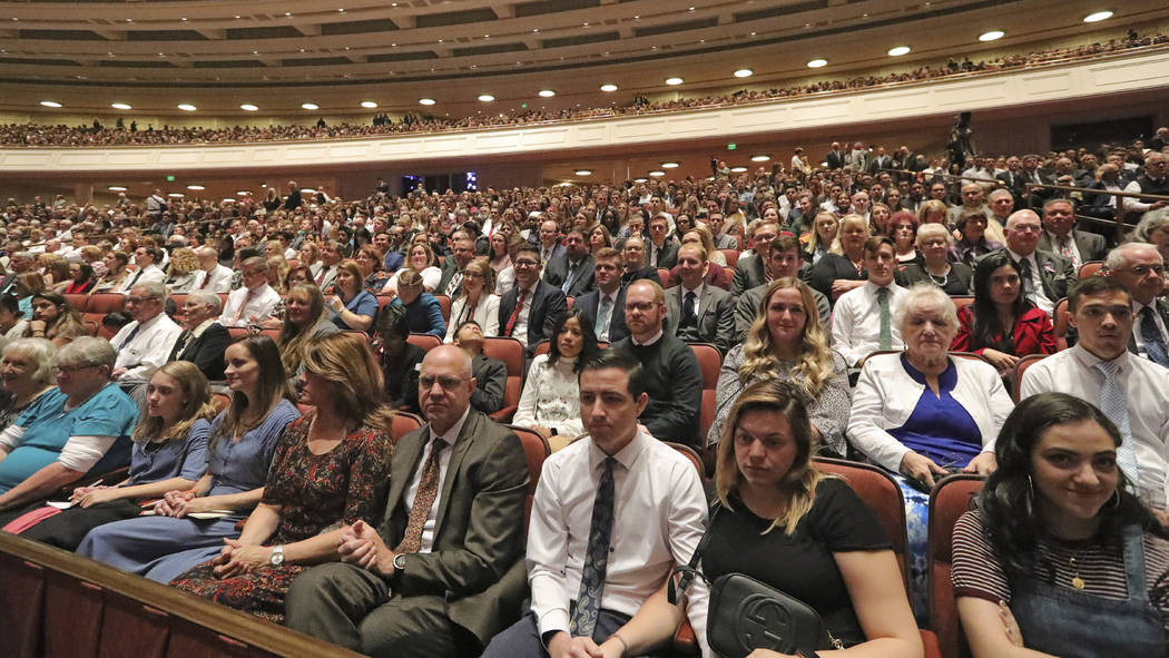 People listen during The Church of Jesus Christ of Latter-day Saints' twice-annual church confe ...