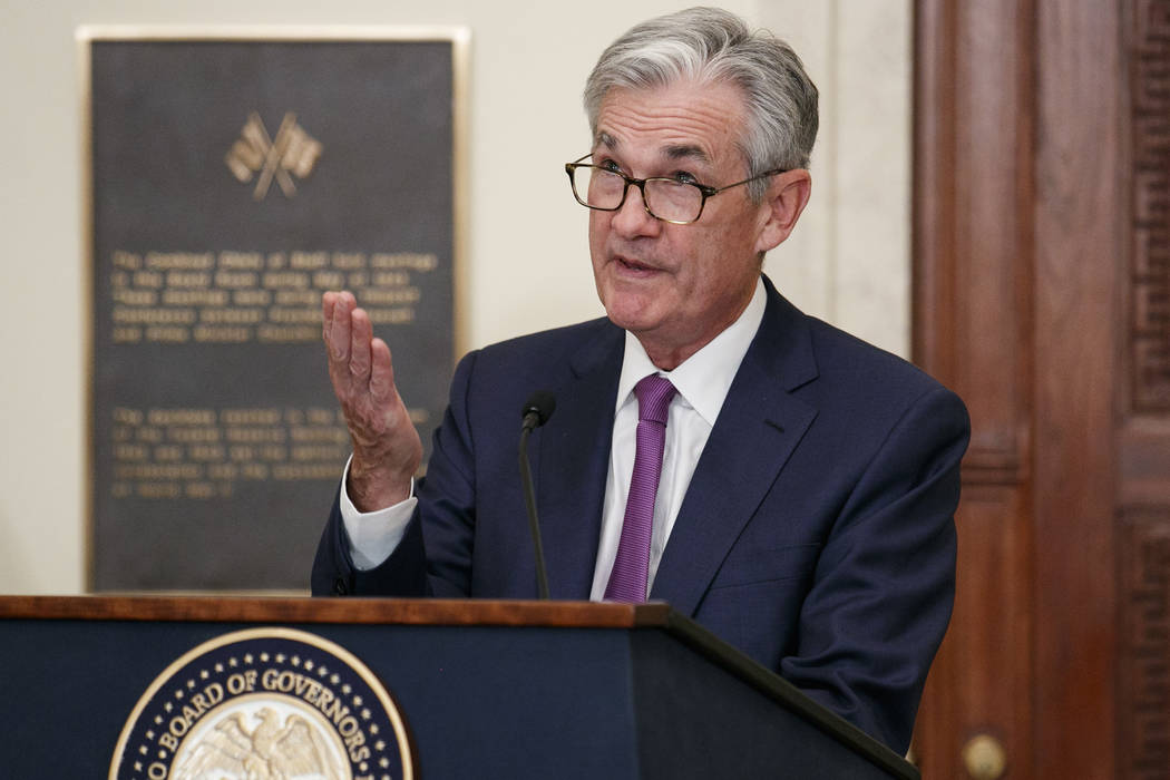 Federal Reserve Chairman Jerome Powell speaks before attending a panel at the Federal Reserve B ...