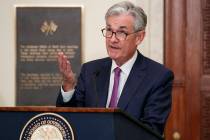 Federal Reserve Chairman Jerome Powell speaks before attending a panel at the Federal Reserve B ...