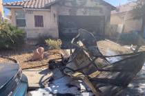 A fire damages a home Sunday, Oct. 6, 2019, on the 6000 block of Dewberry Court in Las Vegas. ( ...