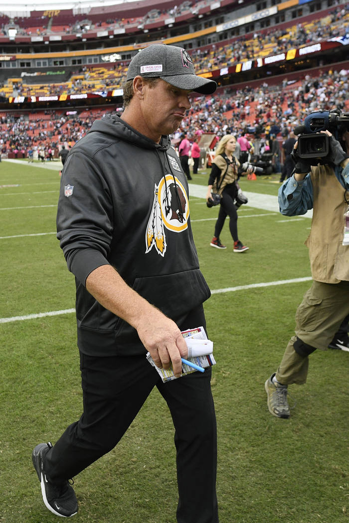 Washington Redskins head coach Jay Gruden leaves the field after an NFL football game against t ...