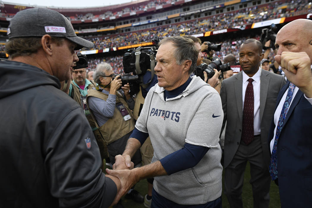 New England Patriots head coach Bill Belichick speaks with Washington Redskins head coach Jay G ...