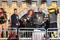 Comedian Carrot Top sounds the siren in the Fortress to begin the 1st period of the game betwee ...