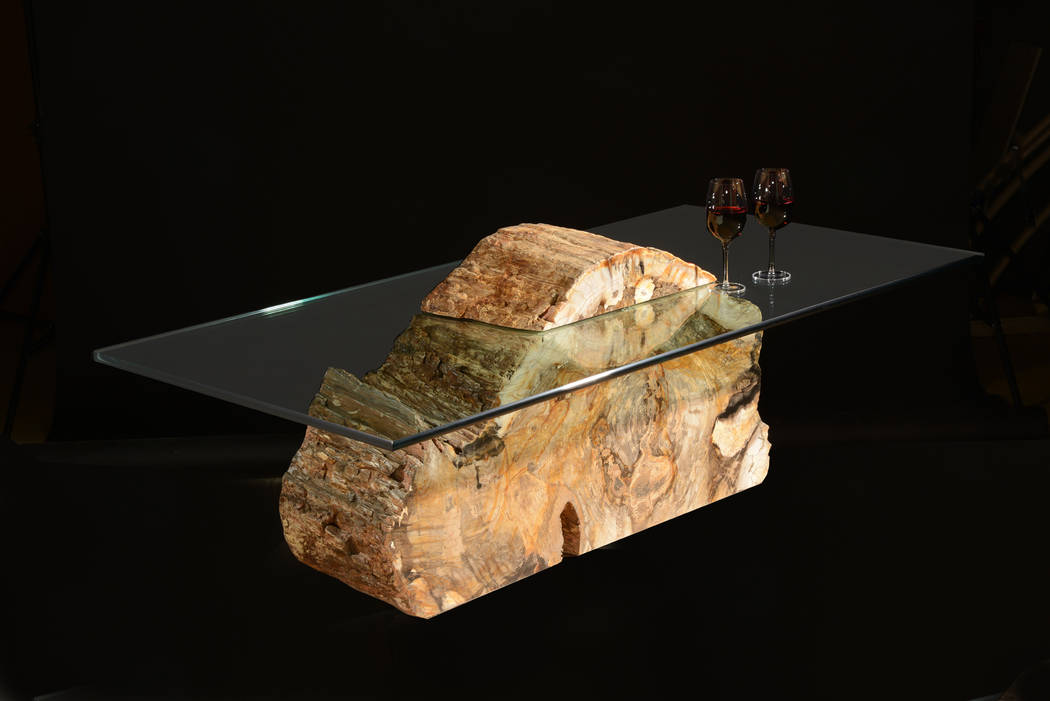 Artist Russell Zuhl creates furniture from petrified wood hundreds of millions of years old. Hi ...