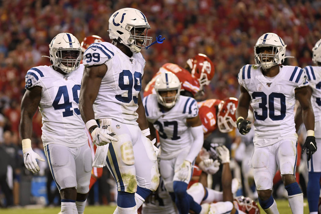 Indianapolis Colts defensive end Justin Houston (99) reacts after tackling Kansas City Chiefs r ...