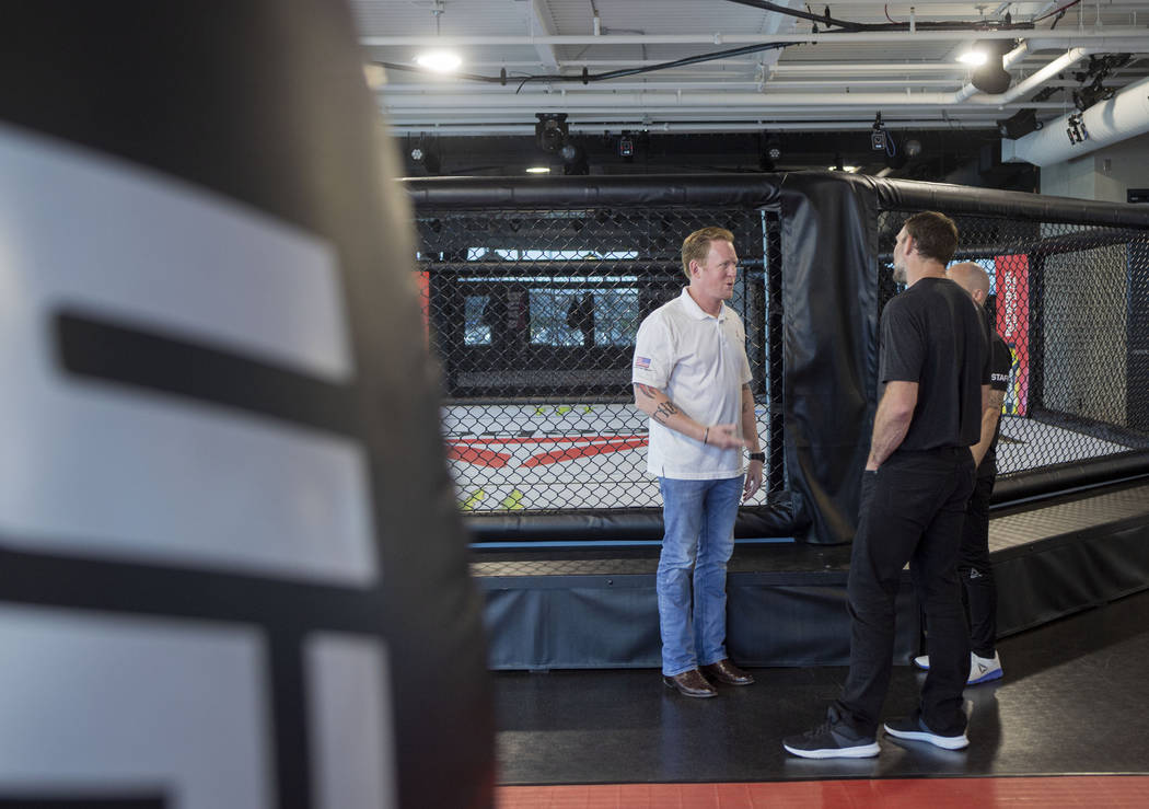 Former SEAL Team Six leader, Rob O'Neill, left, and UFC Hall of Famer Forrest Griffin meet at t ...