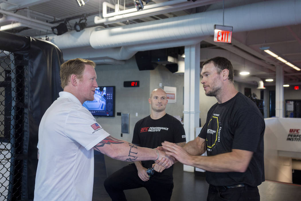 Former SEAL Team Six leader Rob O'Neill, left, Vice President of operations for the UFC Perform ...