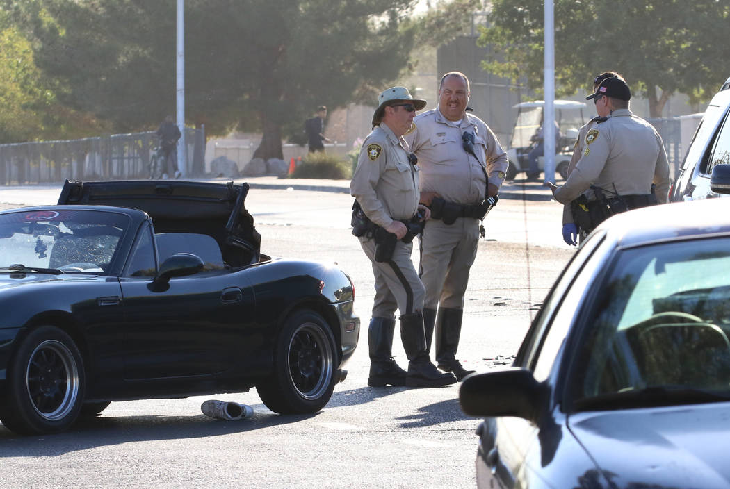 Las Vegas police investigate a serious injury crash at East Harmon Avenue and South Sandhill Ro ...