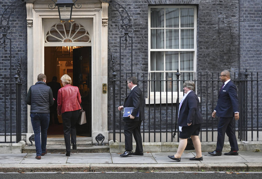Lawmakers arrive for a Cabinet Meeting, with, from 2nd left, Britain's Business Secretary Andre ...