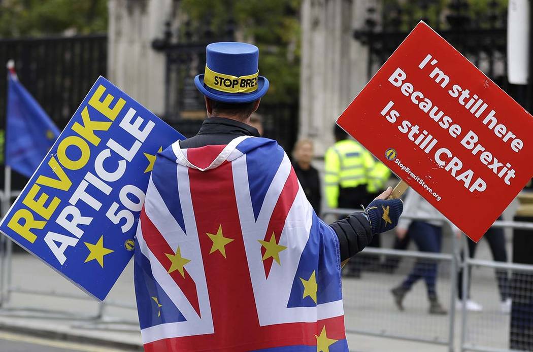 Anti-Brexit campaigner Steve Bray walks near Parliament in London, Tuesday, Oct. 8, 2019. The B ...