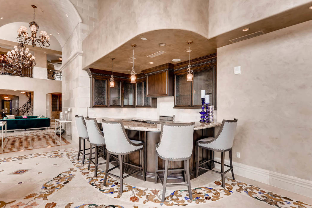 A bar is off the entrance. (Char Luxury Real Estate)
