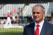 Commissioner Rob Manfred watches as the American League players warm-up for the MLB baseball Al ...