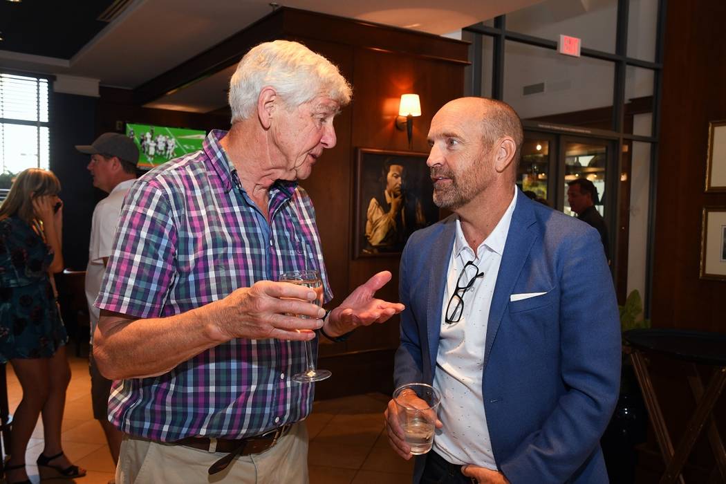 Roger Groves, left, and Simon Keith visit during the latter's foundation golf tournament at Rev ...