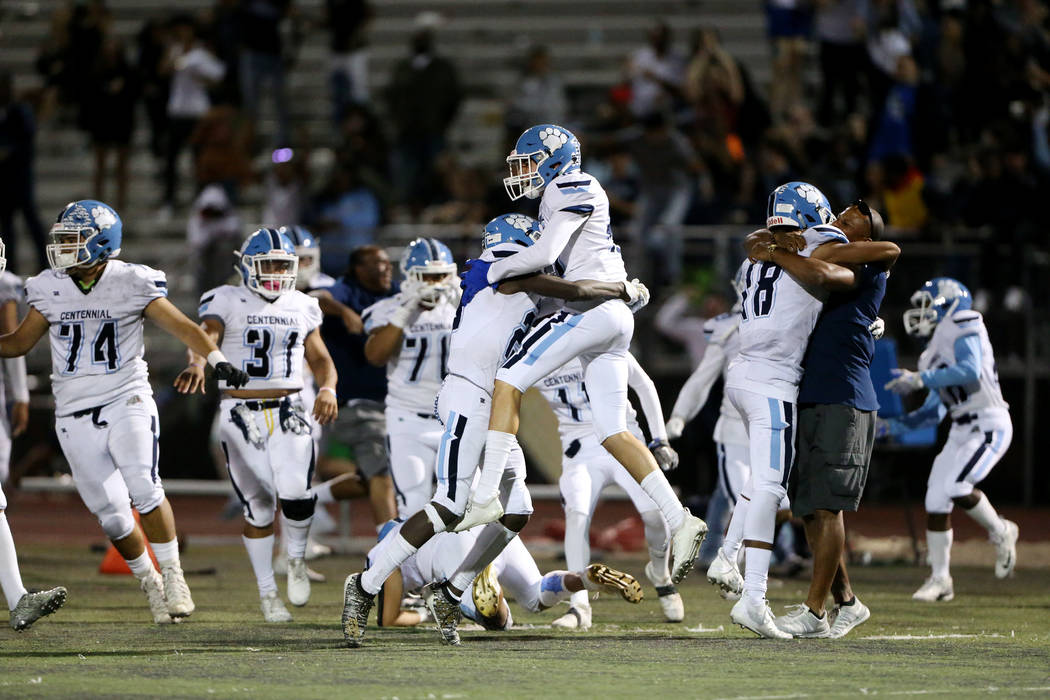Centennial celebrates their 17-14 win against Arbor View in the football game at Arbor View Hig ...