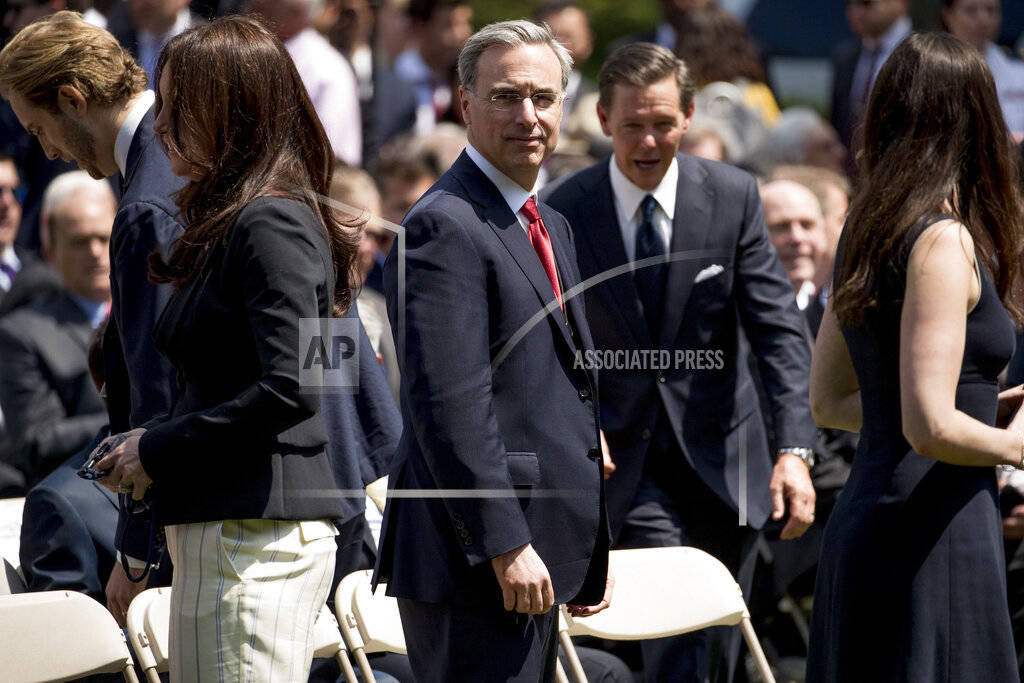 White House counsel Pat Cipollone, center, arrives for an immigration speech by President Donal ...