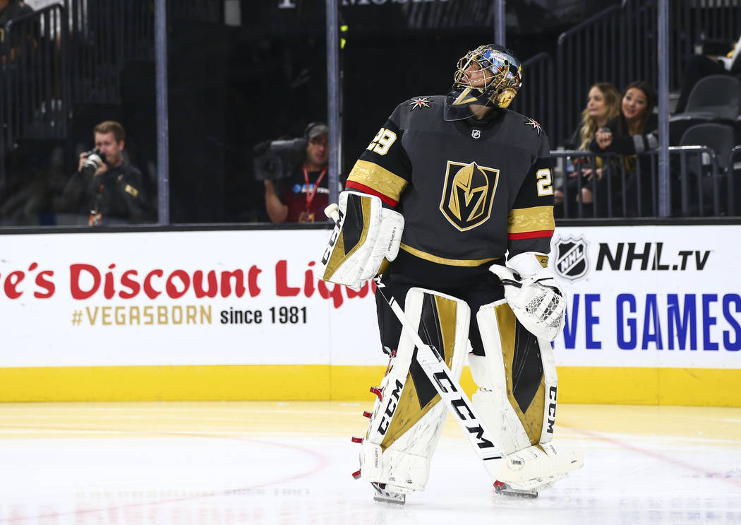 Golden Knights goaltender Marc-Andre Fleury (29) looks up after giving up a goal to the Boston ...