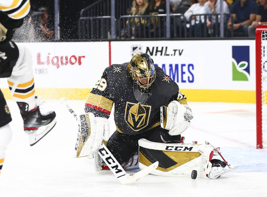 Golden Knights goaltender Marc-Andre Fleury (29) blocks a shot from the Boston Bruins during th ...