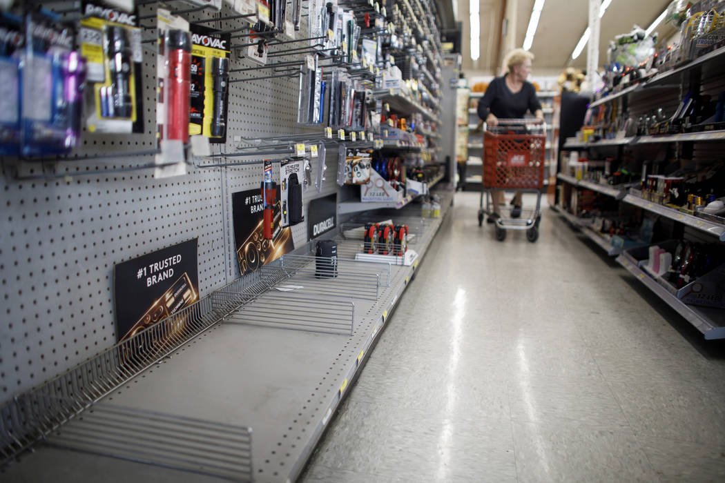 The lantern section is nearly empty at an ACE Hardware store as shoppers prepare for possible p ...