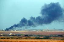 In this photo taken from the Turkish side of the border between Turkey and Syria, in Akcakale, ...