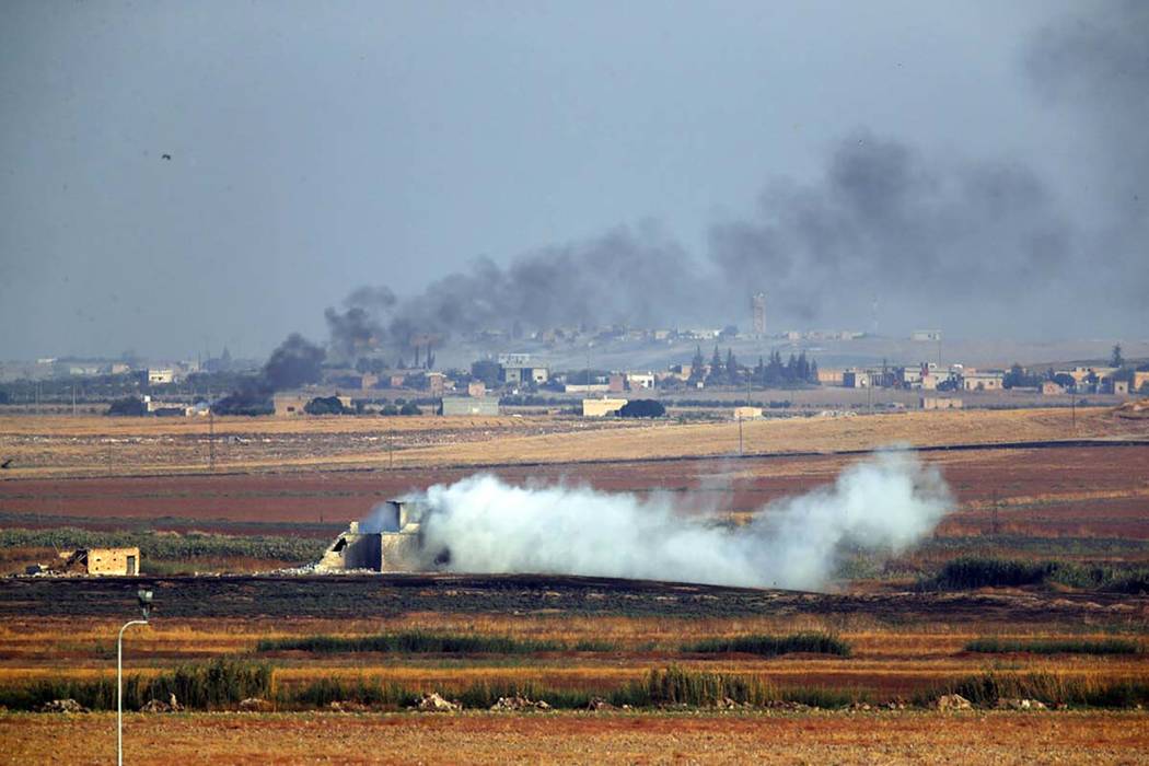 In this photo taken from the Turkish side of the border between Turkey and Syria, in Akcakale, ...