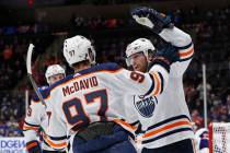 Edmonton Oilers left wing James Neal, right, celebrates with center Connor McDavid (97) after s ...