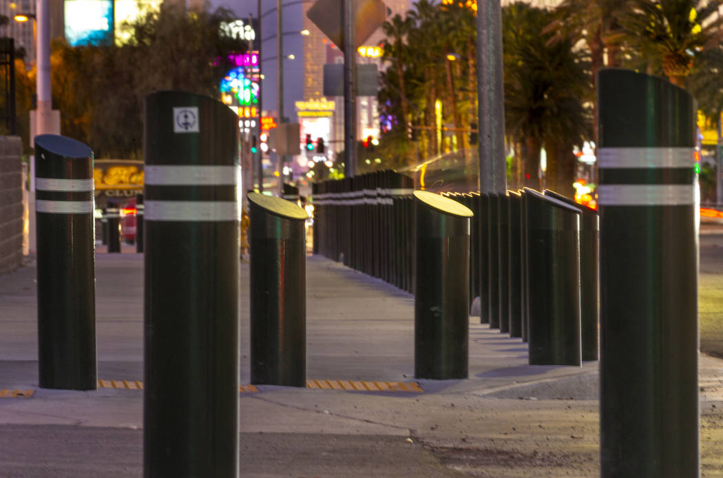 Various sizes of bollards are seen near an exit onto Las Vegas Boulevard South just u ...