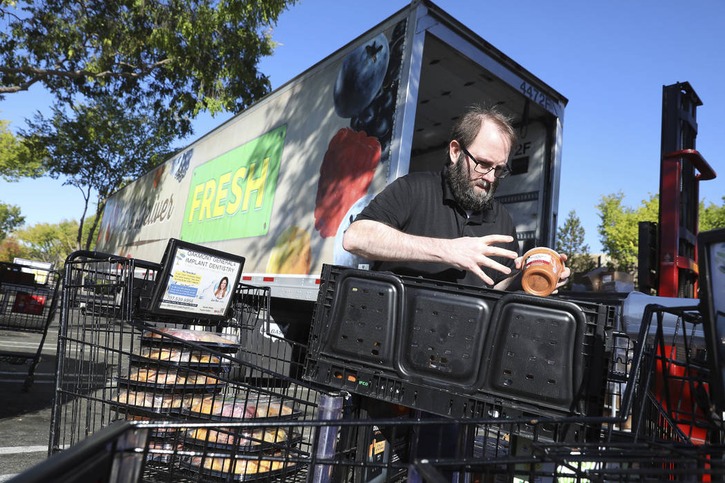 Jamie Olivas transfers items from a Safeway store on Calistoga Road into a refrigerated trailer ...