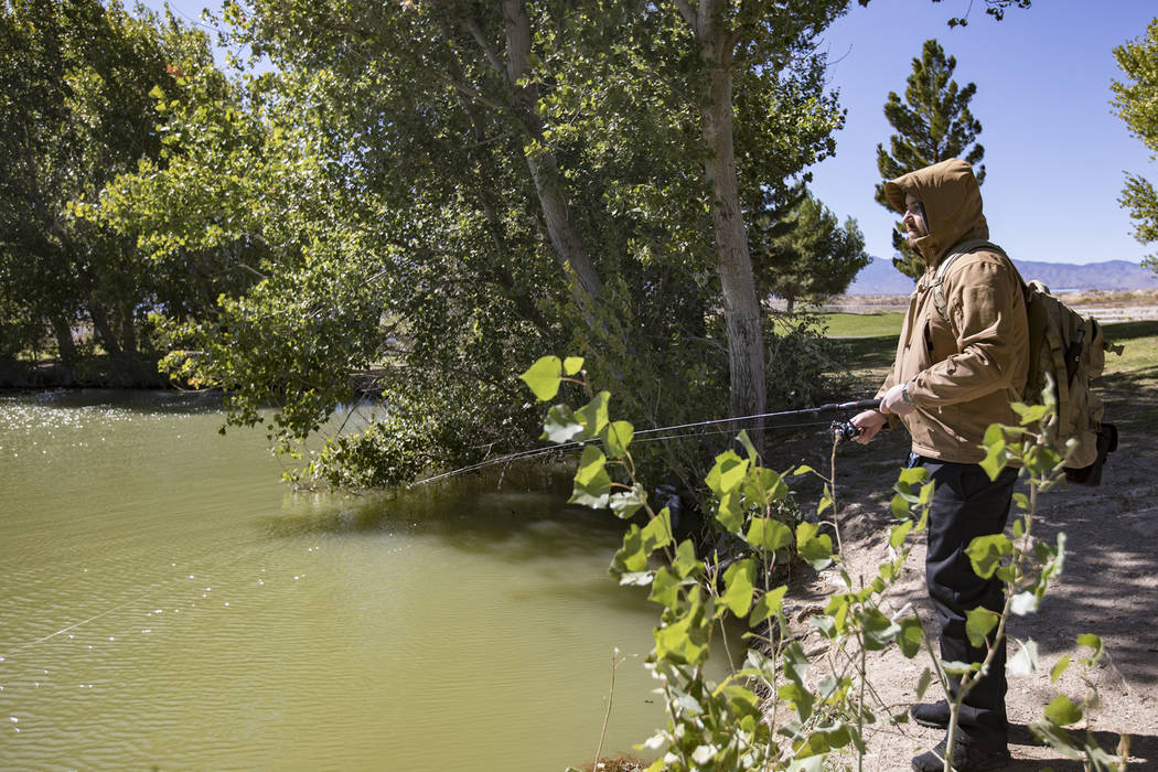 Giovani Simonella fishes for bass at Floyd Lamb Park in Las Vegas, Thursday, Oct. 10, 2019. A s ...