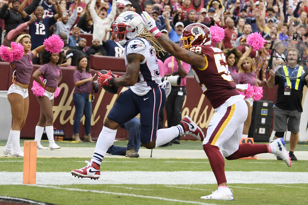 New England Patriots running back Brandon Bolden (38) runs into the end zone for a touchdown ag ...