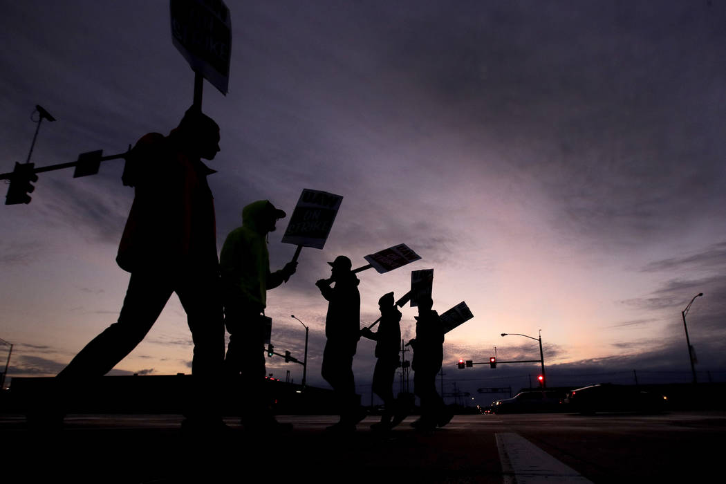 General Motors employees picket outside the Fairfax Assembly Plant in Kansas City, Kan. during ...