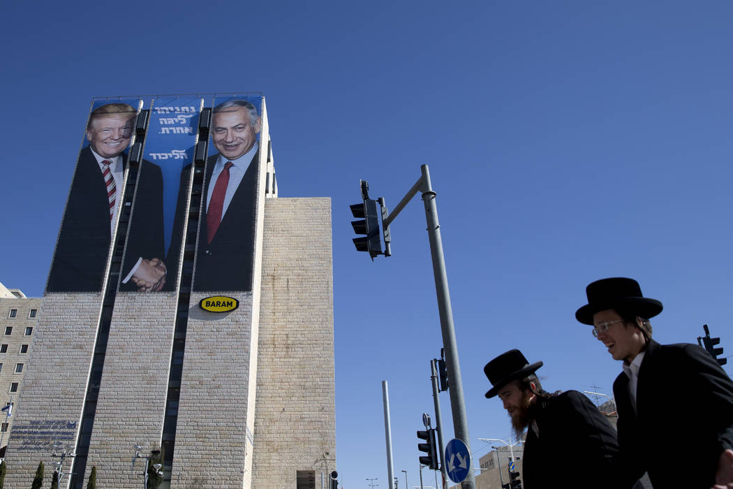FILE - In this Feb. 4, 2019, file photo, an election campaign billboard shows Israeli Prime Min ...