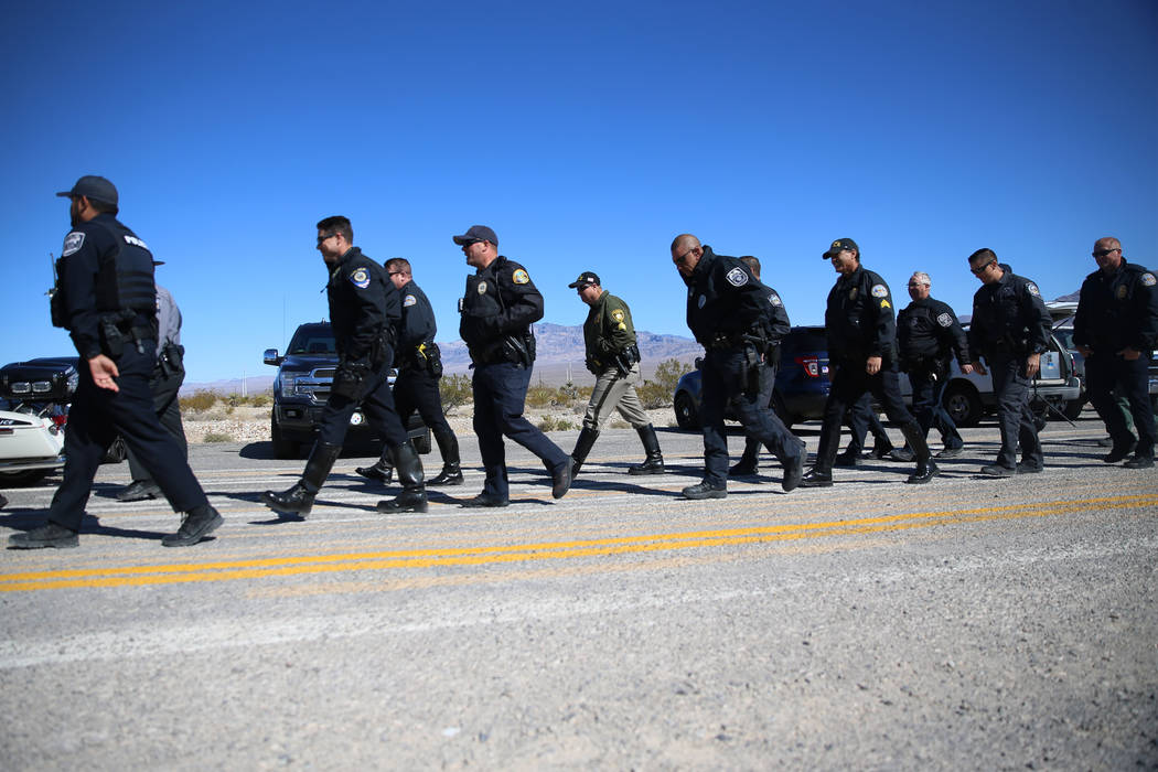 Multi-agency law enforcement officers participate during the DUI Victim Memorial Sign during a ...