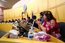 Dorinda Burnet, right, claps during the inaugural meeting of the 15-member Asian-American Pacif ...