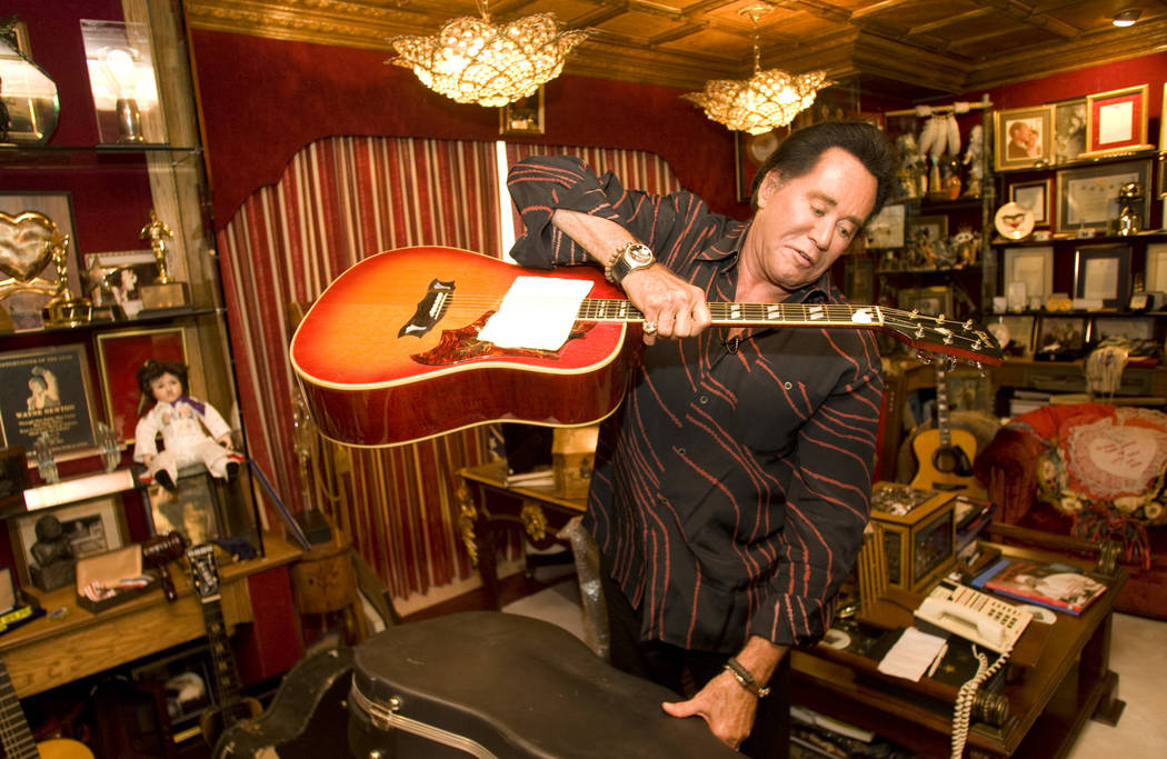Longtime Las Vegas headliner Wayne Newton holds a guitar, which was a gift from Elvis Presley, ...