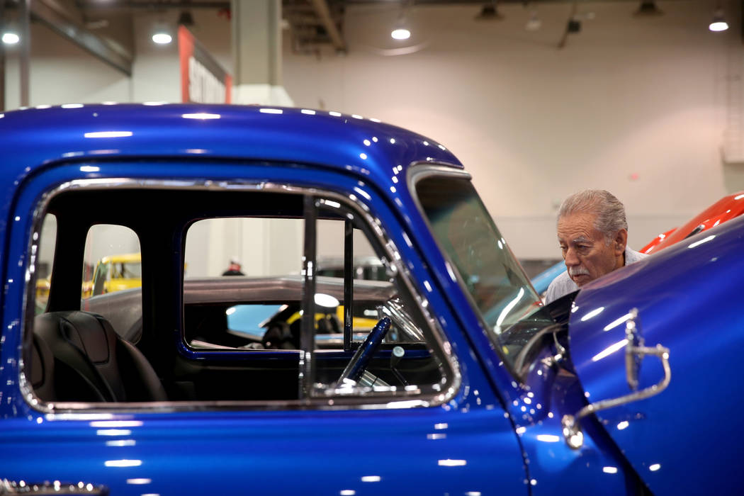 Bob Gutierrez of Las Vegas checks out a 1952 Chevrolet 3100 5-Window pickup that will be in the ...
