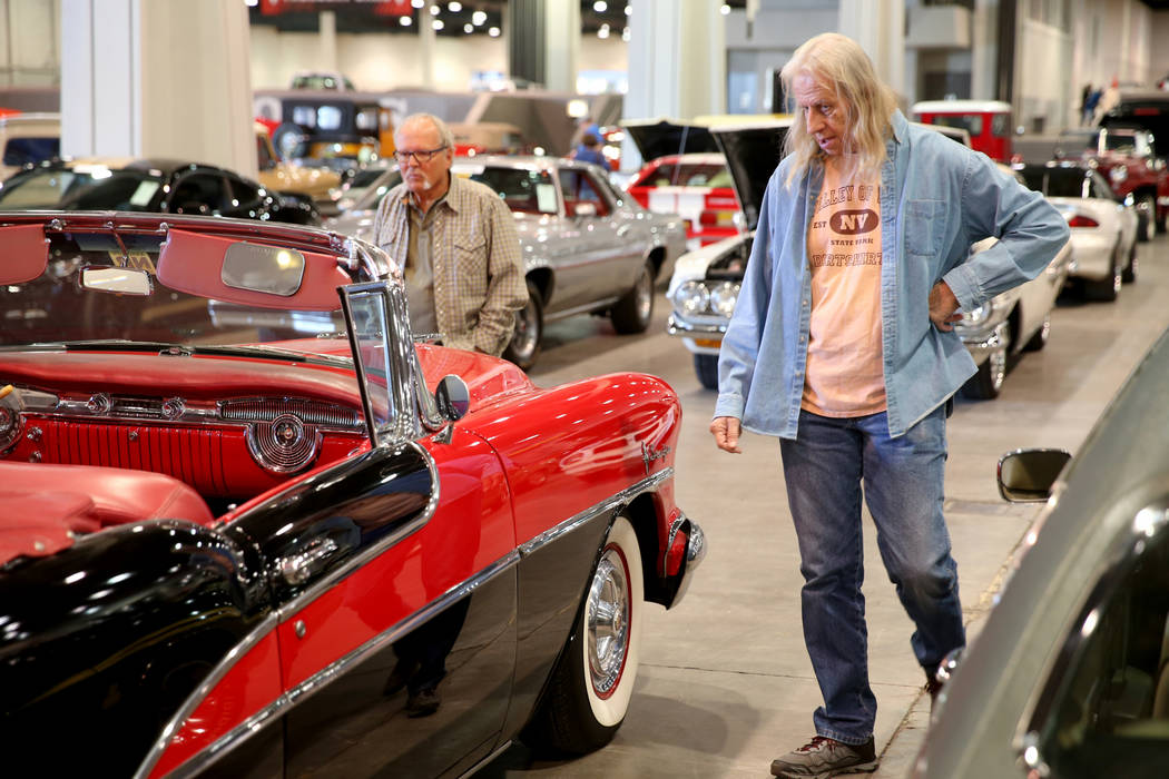 Lon Carlson, left, and Roger Olsen of Las Vegas check out cars during Mecum Las Vegas auction a ...