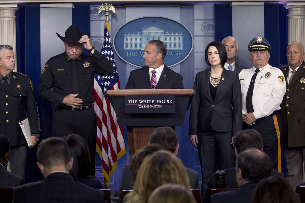 Immigration and Customs Enforcement Director Matt Albence, center, accompanied by sheriffs from ...