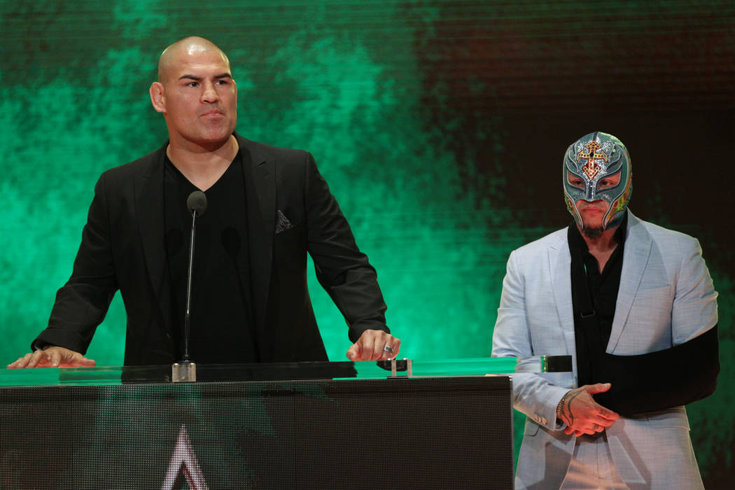 Cain Velasquez, left, and Rey Mysterio, during a World Wrestling Entertainment press conference ...