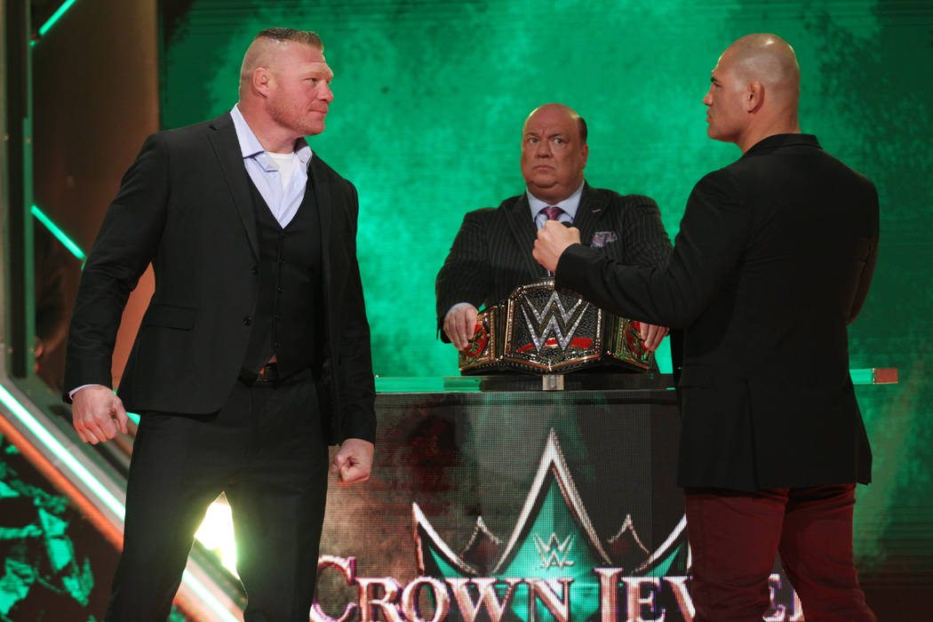 Brock Lesnar, left, with Cain Velasquez, pose during a World Wrestling Entertainment press conf ...