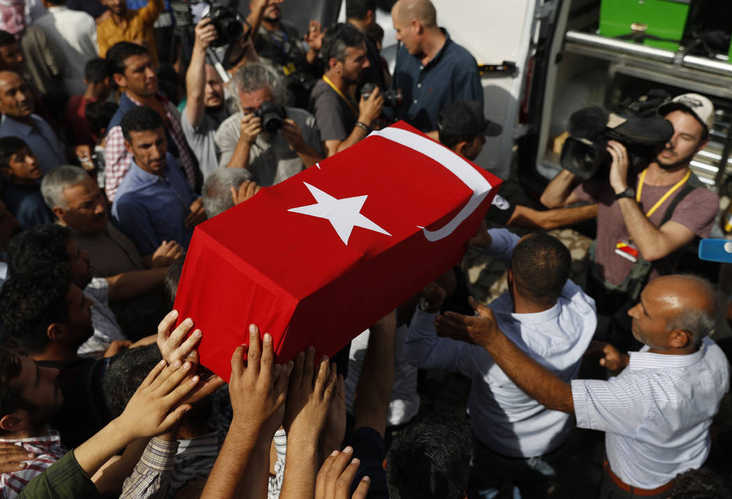 Mourners carry the coffin of ten-month-old Mohammed Omar Saar, killed during incoming shelling ...