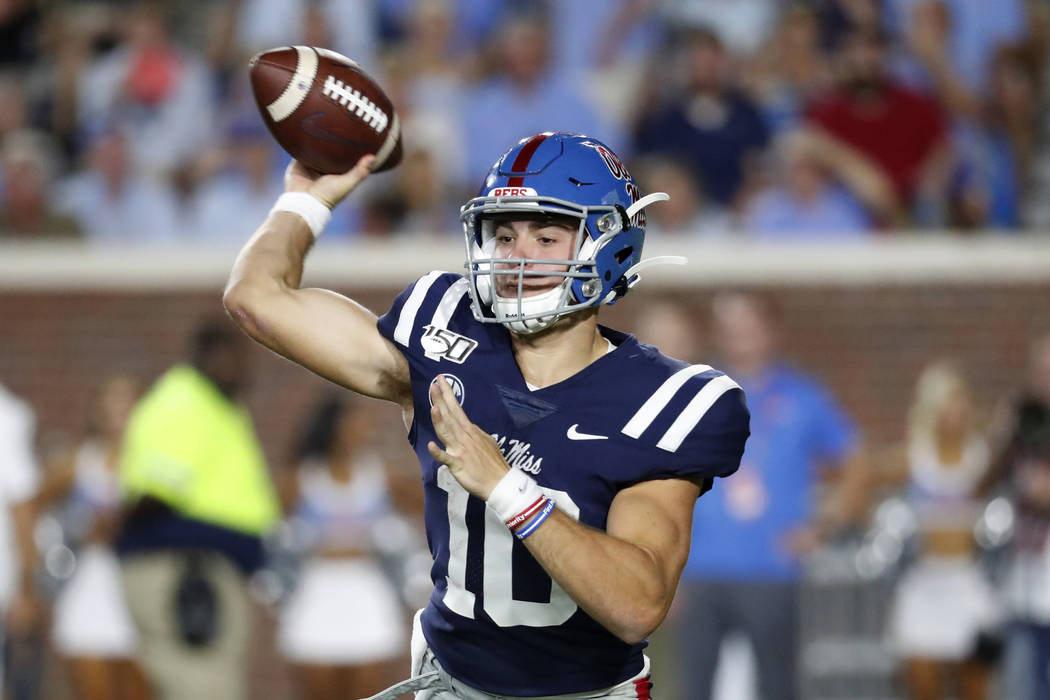 Mississippi quarterback John Rhys Plumlee (10) passes against Vanderbilt during the first half ...