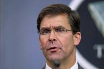 In an Aug. 28, 2019, file photo, Secretary of Defense Mark Esper speaks to reporters during a b ...