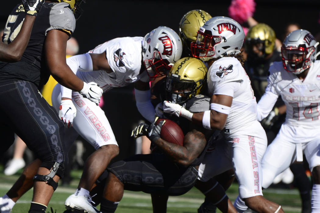 Vanderbilt running back Ke'Shawn Vaughn scores a touchdown against UNLV in the first half of an ...