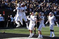 UNLV celebrates a touchdown against Vanderbilt in the first half of an NCAA college football ga ...