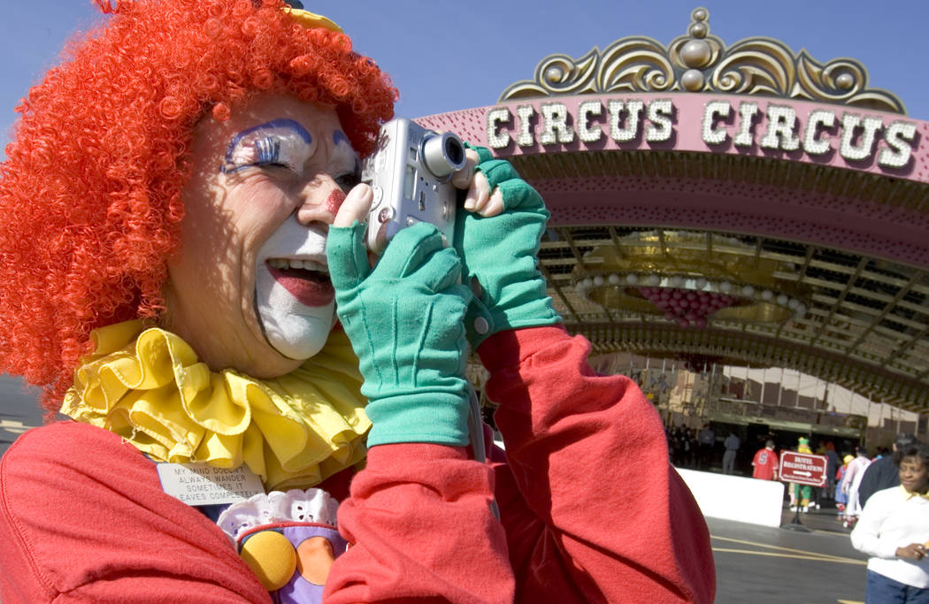 Miss Motzi, from Midland, Texas, takes a photo of other clowns in front of Circus-CIrcus on Thu ...