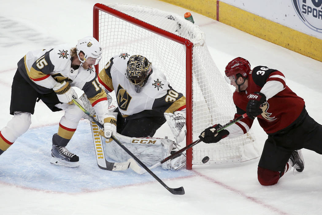 Arizona Coyotes right wing Christian Fischer (36) has his shot stopped by Vegas Golden Knights ...