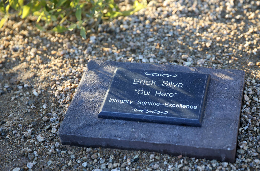 A plaque for Erick Silva, a security guard who was shot trying to help people escape the Oct. 1 ...