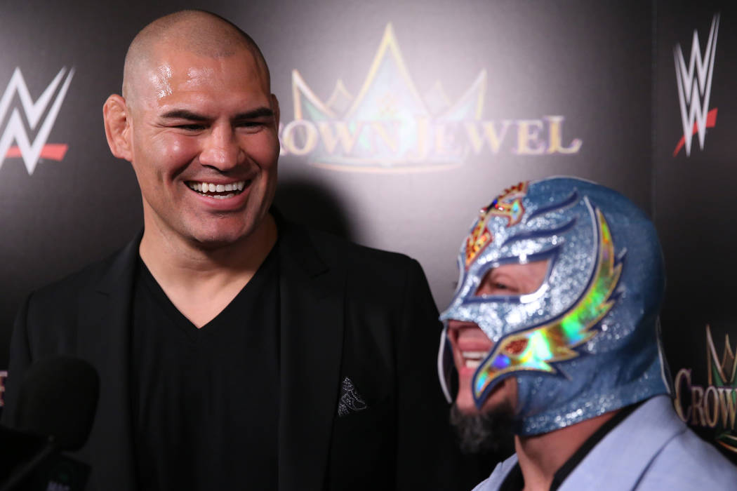 Cain Velasquez, left, and Rey Mysterio, are interviewed during a World Wrestling Entertainment ...