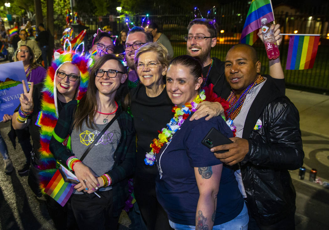 Democratic presidential candidate Sen. Elizabeth Warren, D-Mass., stops for a photo while march ...