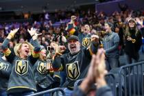 Golden Knights fans celebrate a goal by Cody Glass during the second period of their NHL season ...